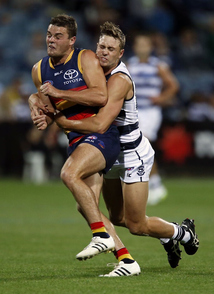 AFL 2015 NAB Challenge - Geelong v Adelaide Mitch Duncan of the Geelong Cats tackles Brad Crouch of the Adelaide Crows during the 2015 NAB Challenge Week 3 match between the Geelong Cats and the Adelaide Crows at Simonds Stadium, Geelong on March 12, 2015. (Photo: David Callow/AFL Media)